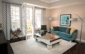 Southgate Apartments in Baton Rouge featuring a living room with a blue couch and a coffee table.